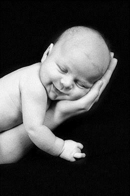 Newborn Baby taken closeup in mother's Hand