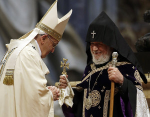 Pope Francis is greeted by the head of Armenia's Orthodox Church Karekin II, during an Armenian-Rite Mass on the occasion of the commemoration of the 100th anniversary of the Armenian Genocide, in St Peter's Basilica, at the Vatican, Sunday, April 12, 2015. (AP Photo/Gregorio Borgia)