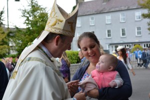 Primate Eamon Martin and baby in Knock