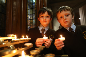 Pic shows twin brothers Ciaran (left) and Andrew Nolan aged 11 as they light candles after the Mass. The two boys attend St Clare's primary school Harolds Cross, Dublin.Pic John McElroy