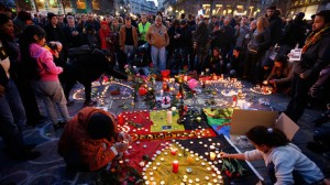 People gather around a memorial in Brussels following bomb attacks in Brussels. Pic courtesy: https://www.rt.com/ 